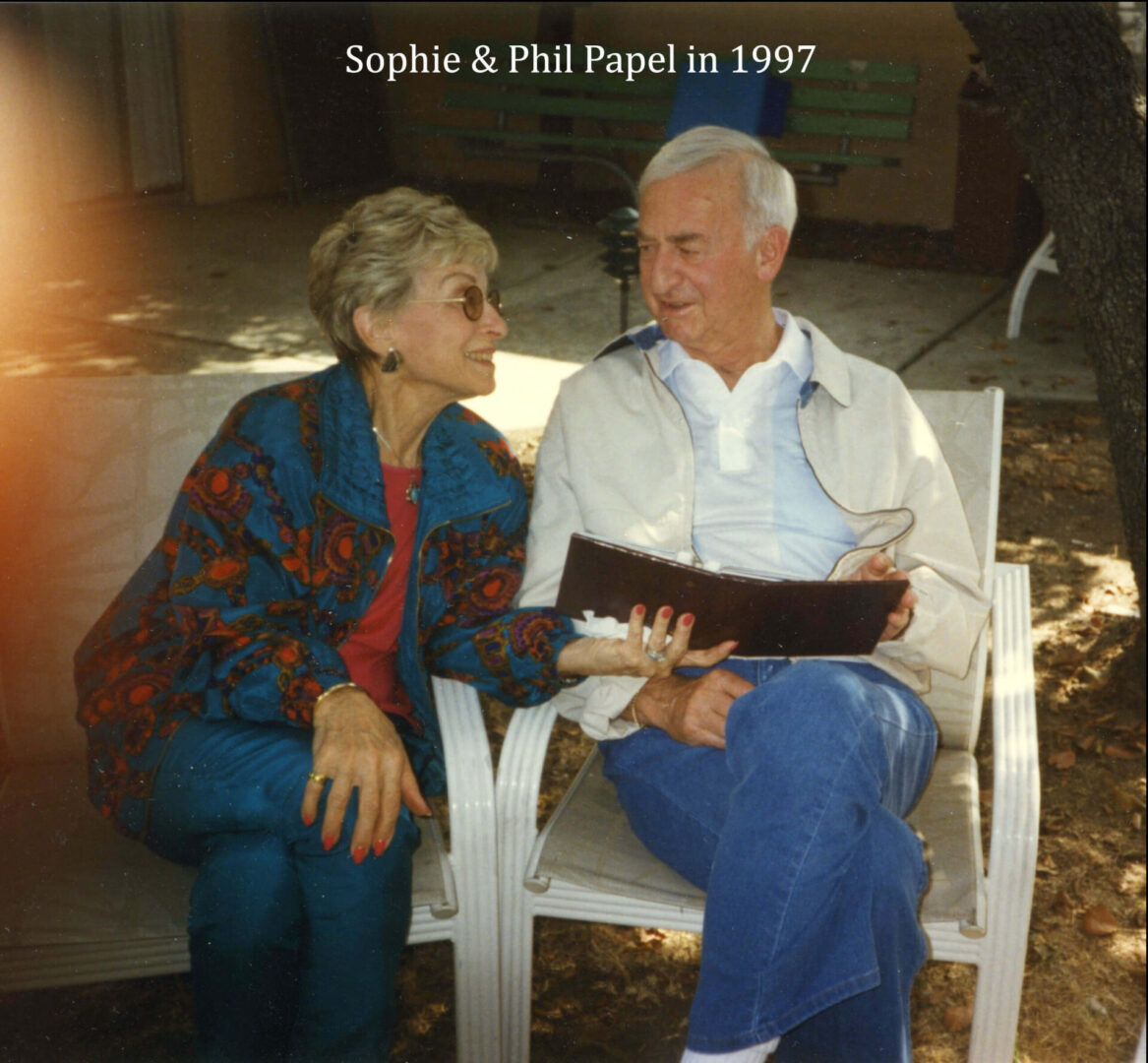 A man and woman sitting on a chair