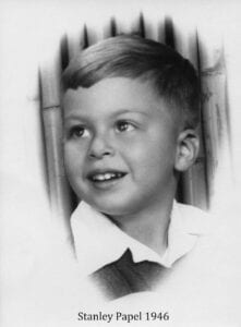 A young boy wearing a tie and shirt.